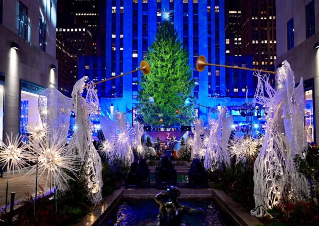 New York Christmas tree surrounded by angel decorations at Rockefeller Plaza