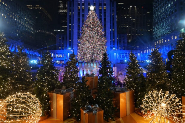 The New York Christmas tree surrounded by gift boxes and holiday lights at Rockefeller Center