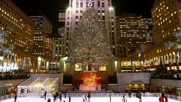 The Rockefeller Center Christmas tree with ice skaters in New York at night