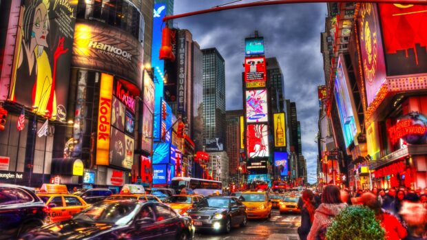 Busy New York streets filled with yellow taxis and vibrant billboards at dusk