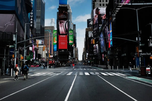 Empty New York streets scene with tall buildings and colorful billboards at Times Square