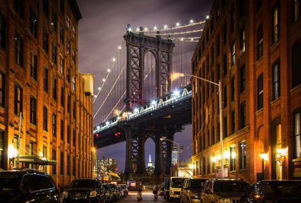 Evening view of New York streets with Manhattan Bridge and surrounding buildings