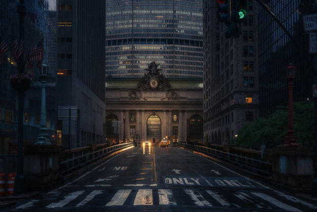 New York streets with Grand Central Terminal illuminated at dusk