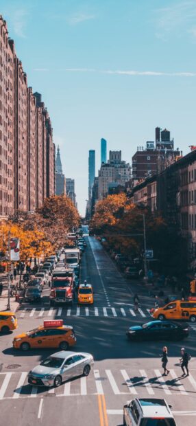 Busy New York Streets with yellow cabs and tall buildings during autumn