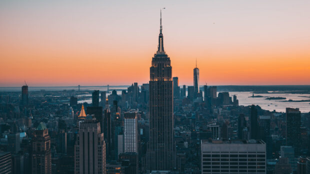 Stunning New York sunset skyline featuring iconic buildings and a colorful evening sky