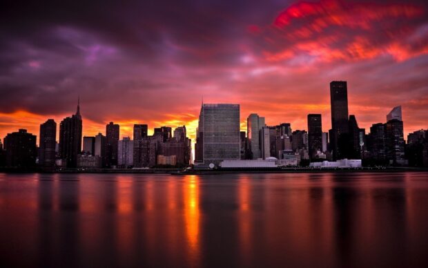 New York sunset with vibrant orange and purple sky over city skyline