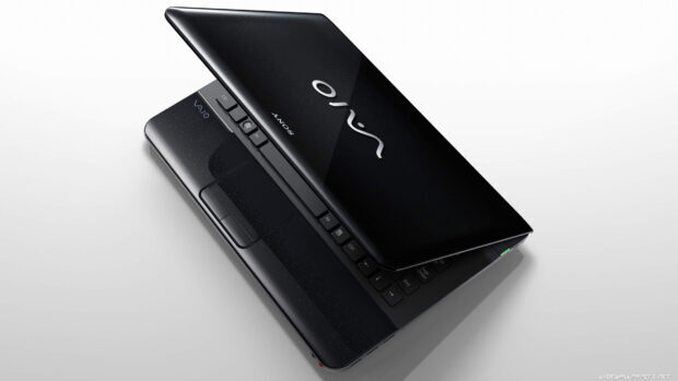 High resolution notebook with partially closed screen and visible keyboard buttons