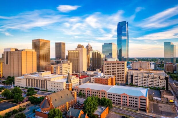 Oklahoma City skyline featuring modern skyscrapers and historic buildings under a blue sky