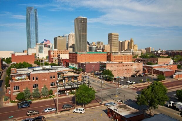 A clear view of Oklahoma City skyline with tall buildings and urban streets on a sunny day