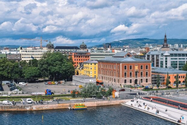 A vibrant view of Oslo cityscape showing colorful buildings and waterfront with clear skies