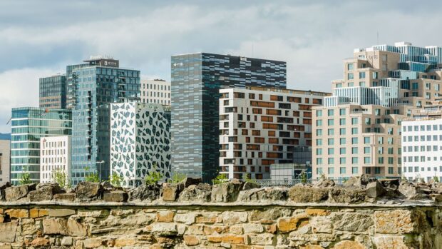 Modern architecture in Oslo city skyline with rocky foreground