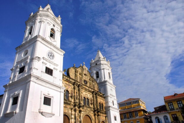 Colonial church architecture in Panama City with clear blue sky and historic buildings
