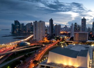 Panama City skyline with illuminated buildings and busy roads at dusk   Copy