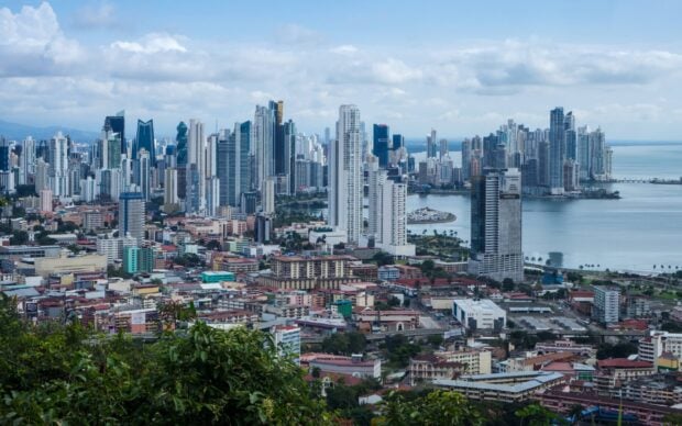 A panoramic view of Panama City skyline with modern buildings and coastal landscape