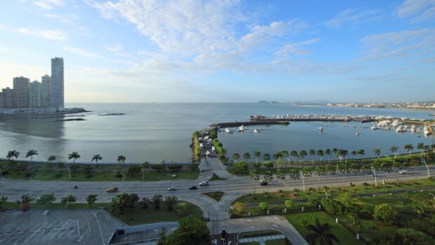 A panoramic view of Panama City skyline with ocean and marina in the background