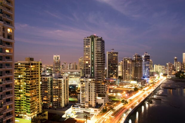 High rise buildings in Panama City skyline at dusk with city lights