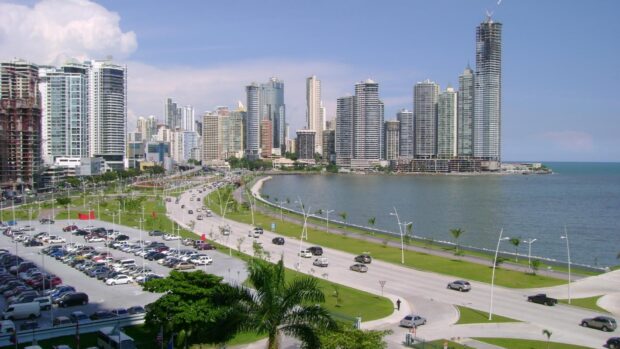 Modern Panama City skyline with tall buildings along the waterfront in a sunny day