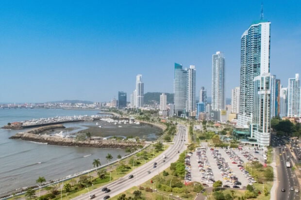 Panoramic view of Panama City skyline and waterfront with high rise buildings and clear sky