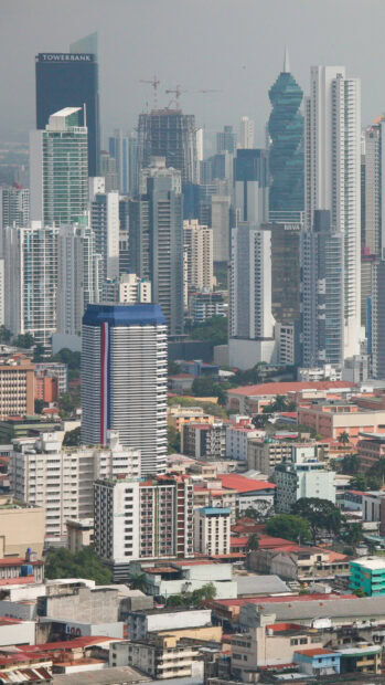 Modern Panama City skyline with various high rise buildings and cranes in HD quality