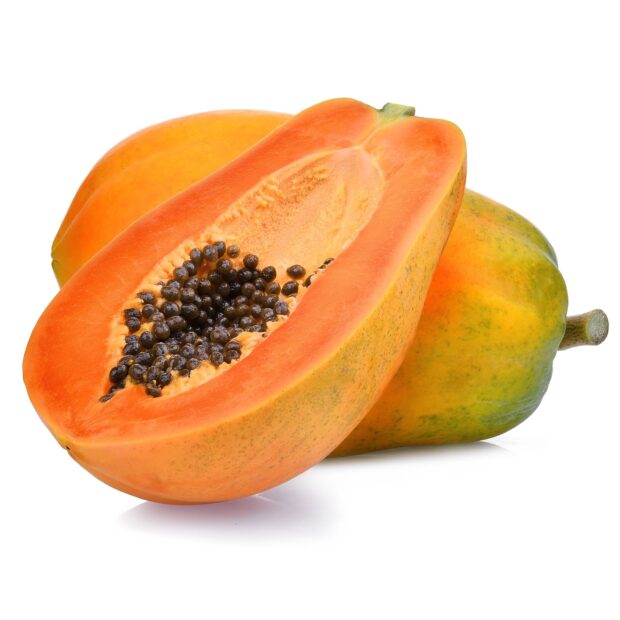 Fresh papaya fruit cut in half showing black seeds and orange flesh