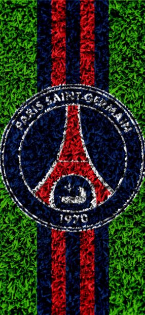 The Paris Saint Germain logo made of colored grass on a sports field