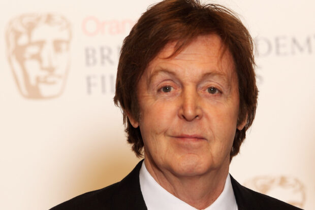 Paul Mccartney close up portrait at a formal event with a suit and tie
