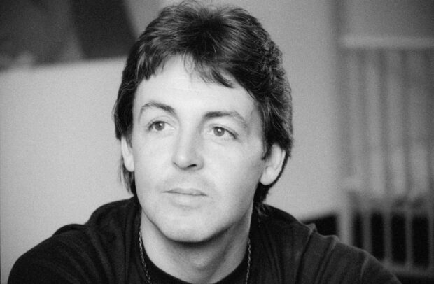 A portrait of Paul McCartney looking thoughtfully to the side