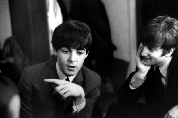 Paul Mccartney talking to a friend in a candid moment