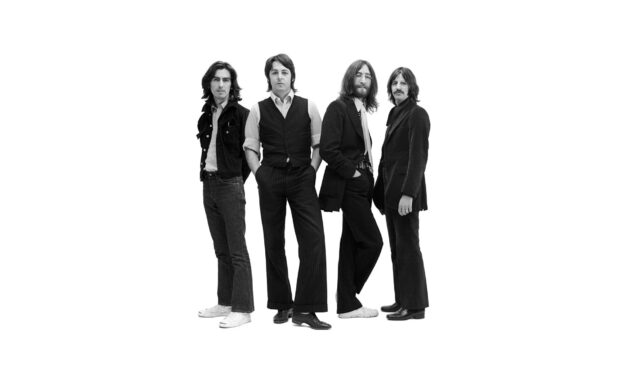 The Beatles band members posing in classic black and white photo including Paul Mccartney