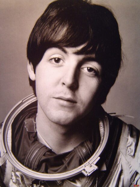 Young Paul Mccartney wearing a space suit looking at the camera in black and white