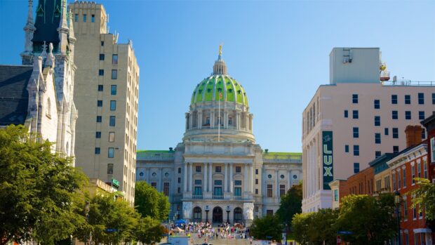 Pennsylvania State Capitol building in Harrisburg with a green dome under a clear blue sky