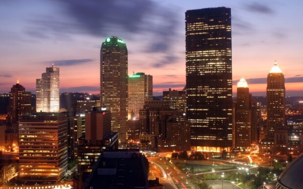 Cityscape of Pennsylvania skyline with illuminated skyscrapers at dusk