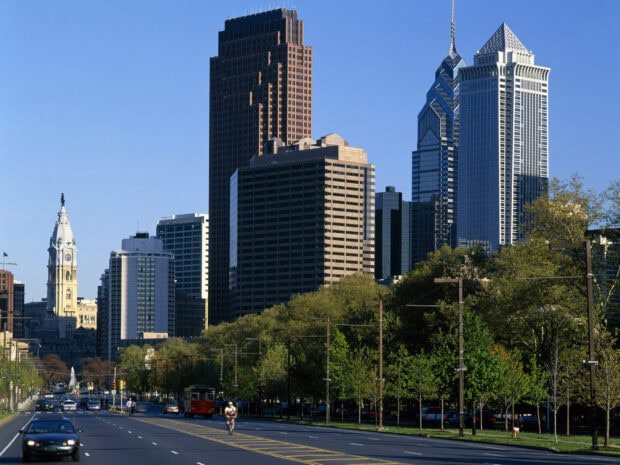 Downtown skyscrapers and green trees in Pennsylvania cityscape showing urban life and architecture