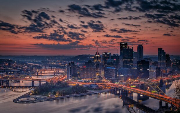 Pennsylvania cityscape with bridges and river at sunset in Pennsylvania