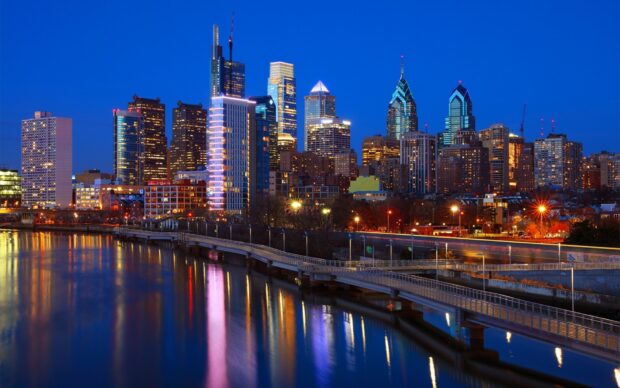 Philadelphia city skyline at night with river reflections in Pennsylvania
