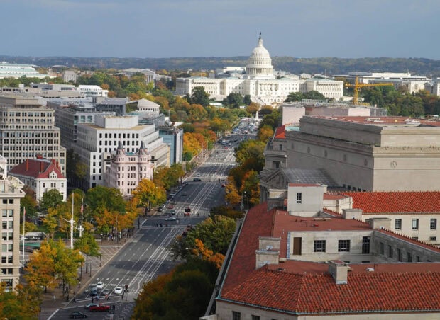 Aerial view of Pennsylvania cityscape with historic buildings and autumn trees lining the streets