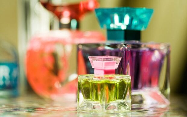 A close up of perfume with colorful bottles and unique designs