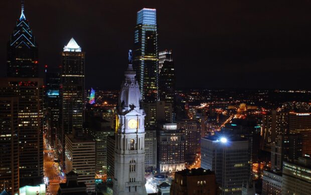 Philadelphia Pennsylvania cityscape at night with illuminated city hall tower and skyscrapers