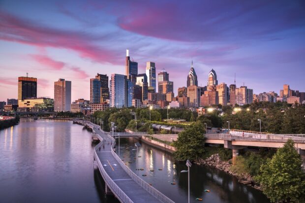 Philadelphia cityscape with river and walkway at sunset in Pennsylvania
