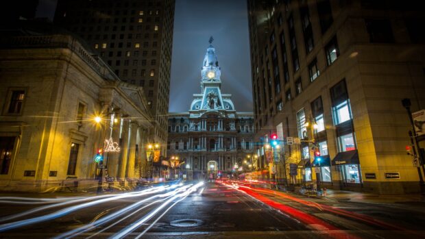 Philadelphia city hall at night with light trails on the street in Pennsylvania