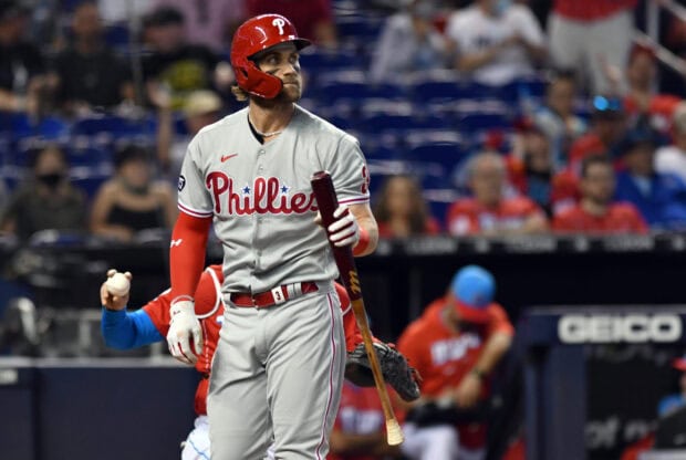 A Philadelphia Phillies player holding a bat during a baseball game