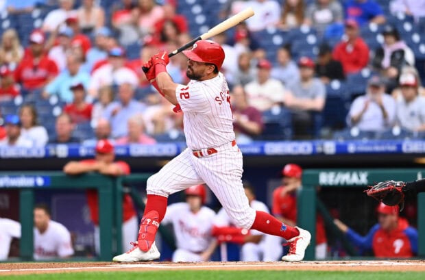 A Philadelphia Phillies player swinging a bat during a baseball game at the stadium