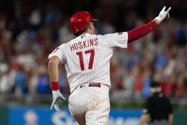 Hoskins from the Philadelphia Phillies celebrating during a baseball game in a white pinstripe uniform