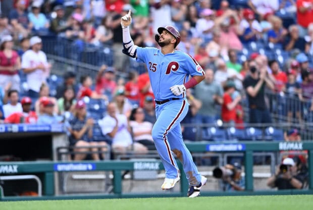 A Philadelphia Phillies player wearing a light blue uniform celebrating during a baseball game