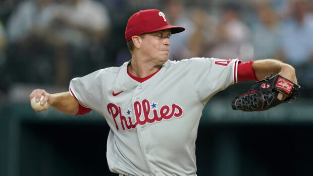 A Philadelphia Phillies player pitching the baseball during a game on the field