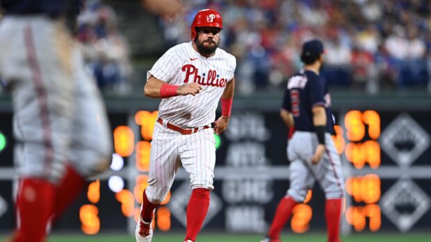 A Philadelphia Phillies player running on the field during a baseball game in uniform