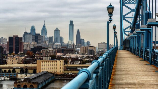 View of the Philly skyline with bridge and buildings on a cloudy day