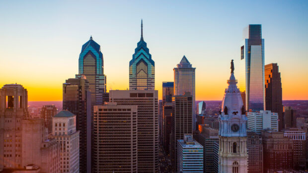 Philadelphia skyline with iconic architecture during sunset featuring Philly skyline