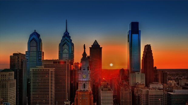 Philadelphia skyline with sunset and city buildings in clear evening sky
