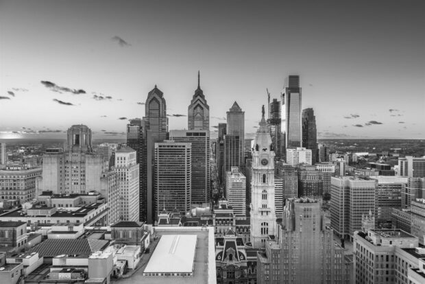 Philly skyline with iconic buildings and cityscape under a clear sky in black and white